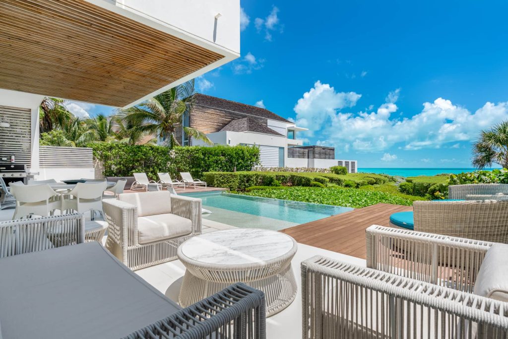 view from the outside of the villa towards the private beach of long bay beach club