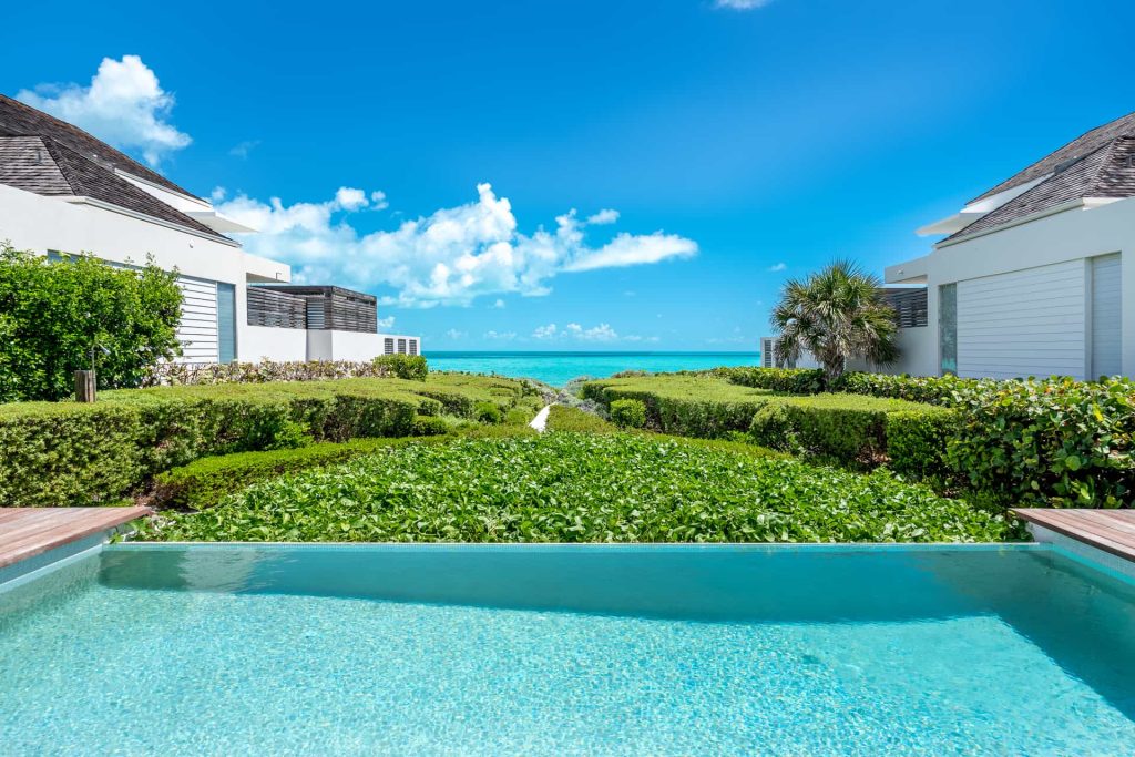 view from the swimming pool of the luxury beachfront villas at long bay beach club