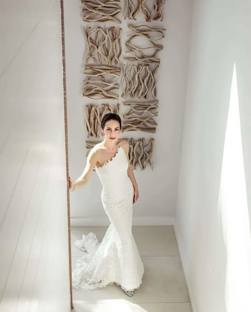 girl in a wedding dress walking through the private villas of the long bay beach club in turks and caicos