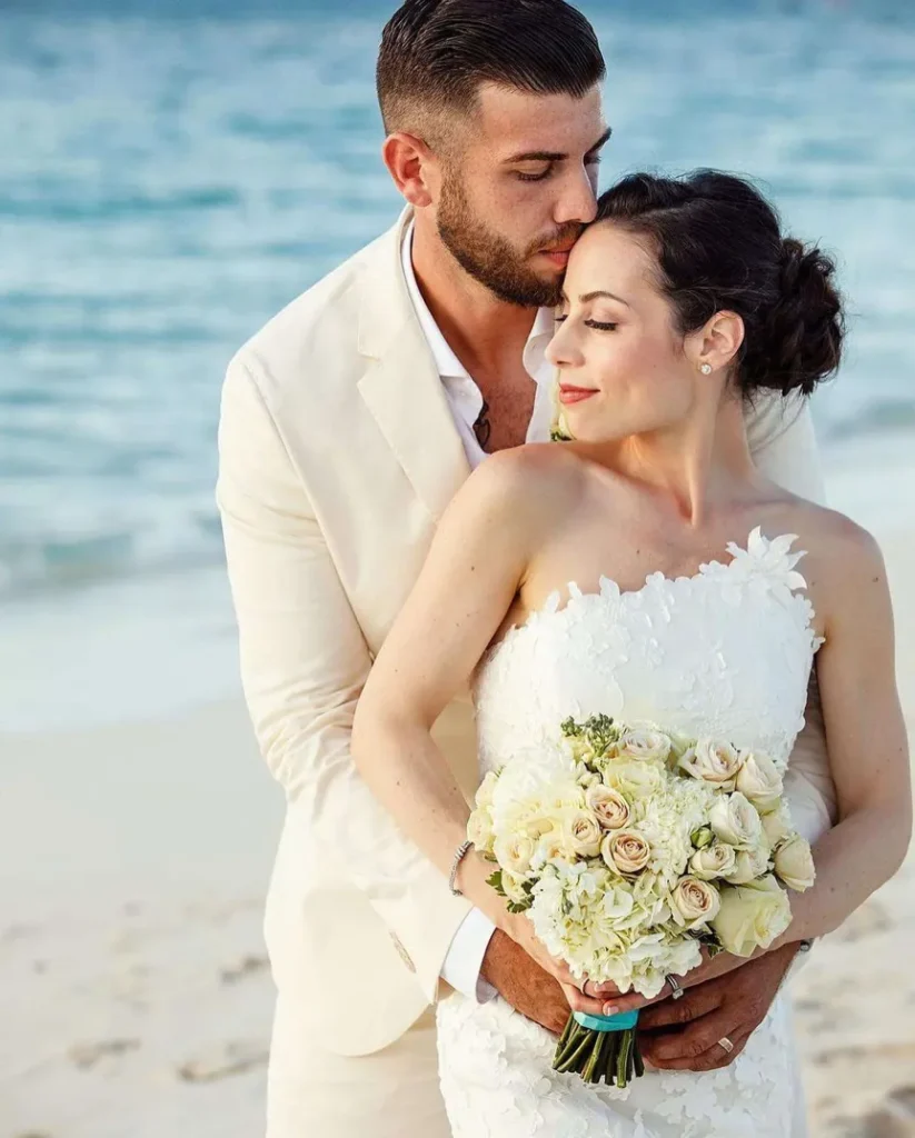 couple posing for wedding photo on the private beaches of turks and caicos long bay beach club